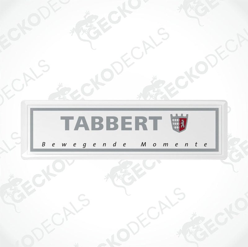 Two gray vinyl stickers with the text 'Tabbert Bewegende Momente' and the Tabbert logo, placed against a white background.