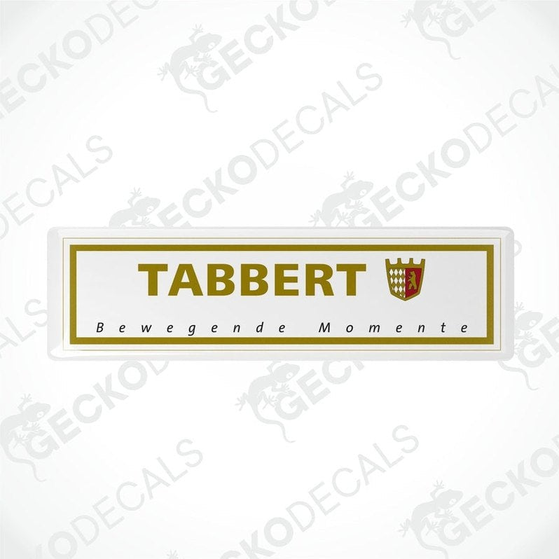 Two white vinyl stickers with the text 'Tabbert Beweegende Momente' and a coat of arms symbol, with a GeckoDecals watermark on the bottom right.