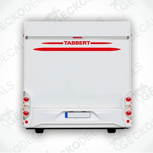 A white caravan with a red and white 'Tabbert' sticker on the back door.