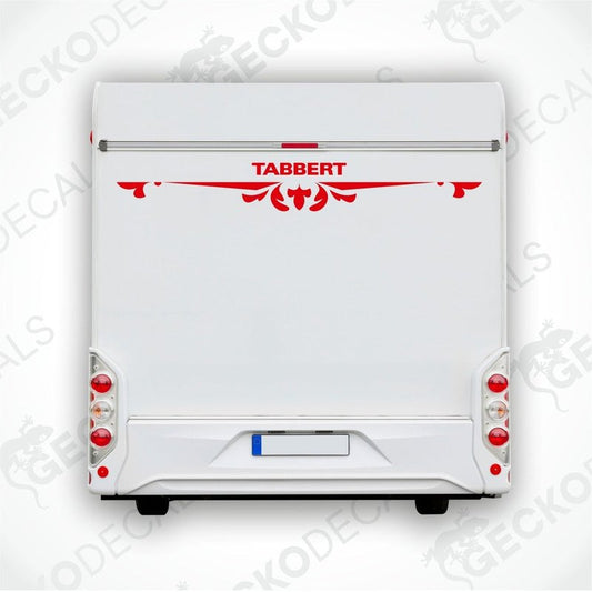 A white caravan with a red and black Tabbert sticker on the back door.