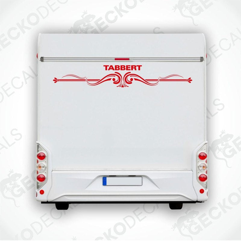 A white caravan with a red and white Tabbert sticker on the back door.
