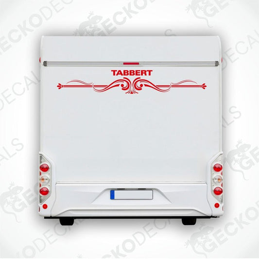 A white caravan with a red and white Tabbert sticker on the back door.