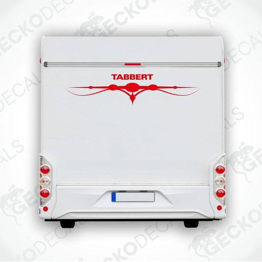 A white caravan with a red and black Tabbert sticker on the back door.