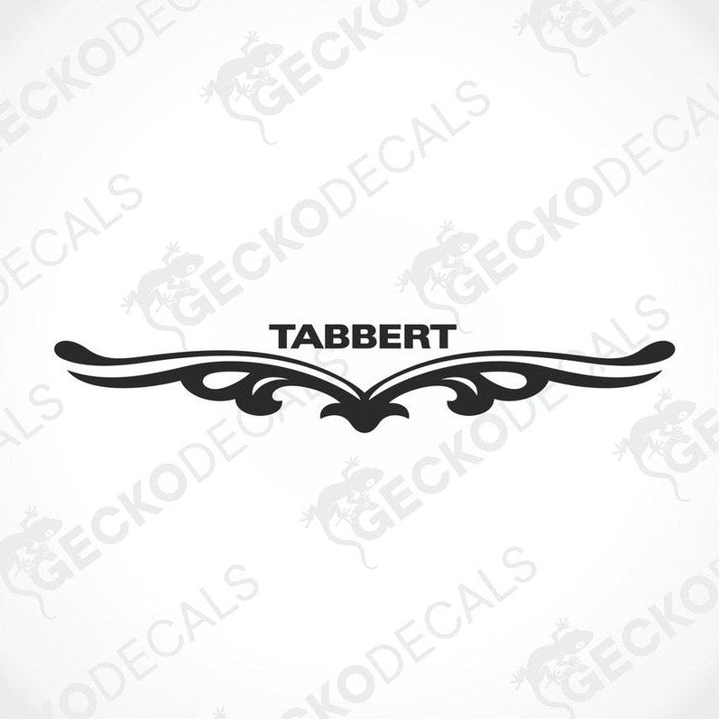 A white caravan with a red and black 'Tabbert' brand decal on the back door.