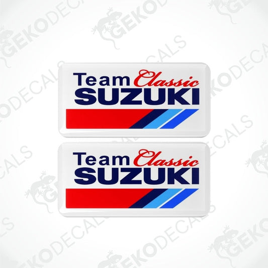Two white vinyl stickers with red, blue, and gray 'TEAM CLASSIC SUZUKI' text and a blue cobalt logo.