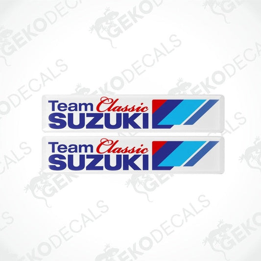 Two rectangular car decals with the text 'Team Classic SUZUKI' and a blue and red stripe design on a white background.