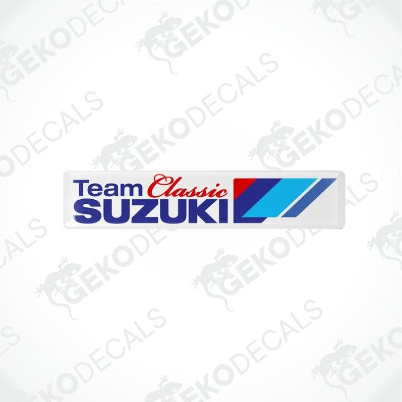 Rectangular car decals with the text 'Team Classic SUZUKI' and a blue and red stripe design on a white background.