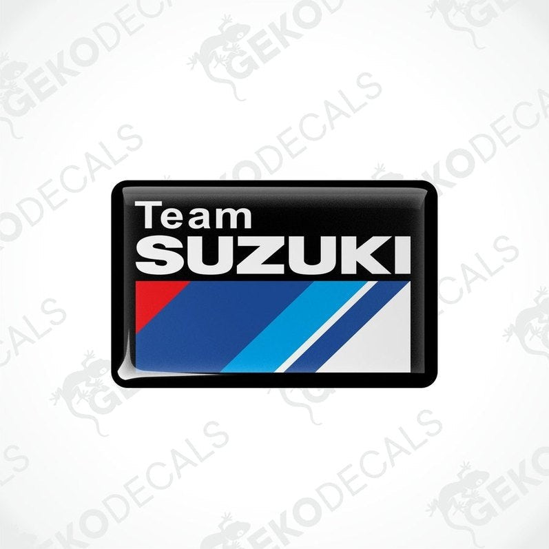  Vinyl stickers with a TEAM SUZUKI design, featuring red, blue, white, and black colors and the Suzuki logo.