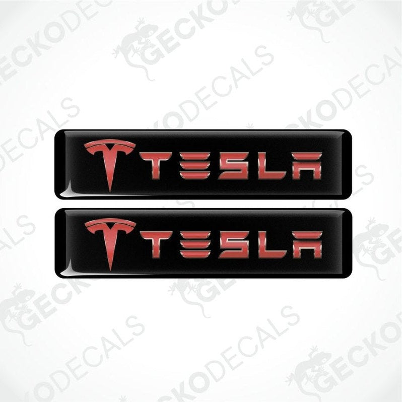 Two Tesla logo decal stickers on a white background with 'Gecko Decals' branding.