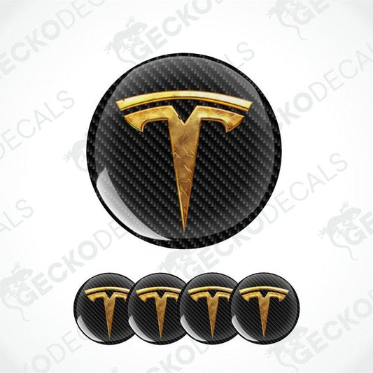 Gold Tesla logo on black carbon fiber pattern with five smaller logos below on a white background.
