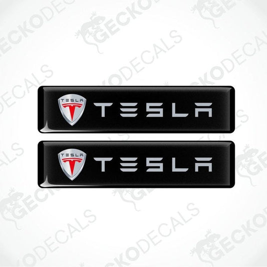 Two Tesla logo decal stickers on a white background with 'Gecko Decals' branding.