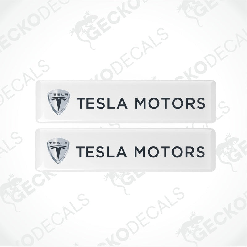 Two Tesla Motors decals with logo and text on a white background