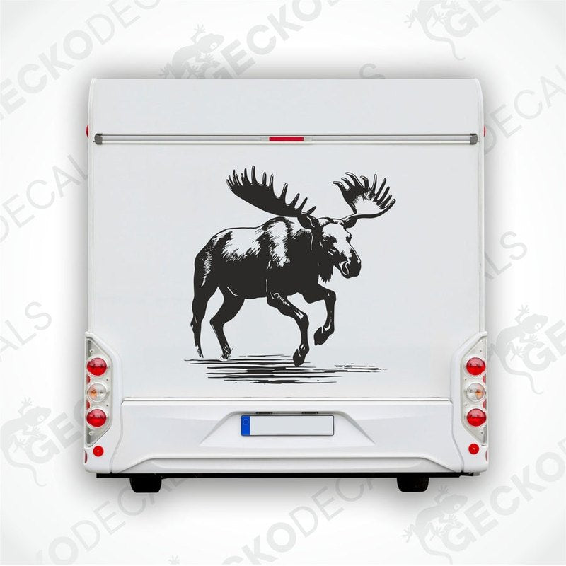 A black and white die cut sticker of a running moose applied on the side of a white car.