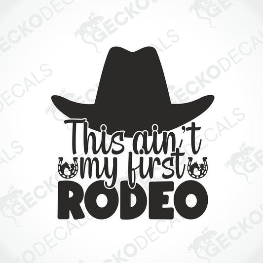 A black die cut decal with the text 'This Ain't My First RODEO' and a hat graphic.