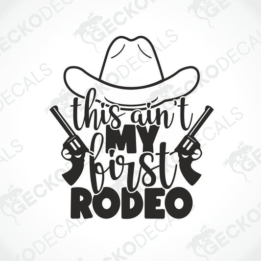 A black and white die cut decal with the text 'This Ain't My First Rodeo' and illustrations of a cowboy hat, a lasso, and a gun.