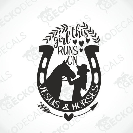 A black and white die cut decal with a design that includes a girl, horses, and the text 'This girl runs on Jesus and horses'.
