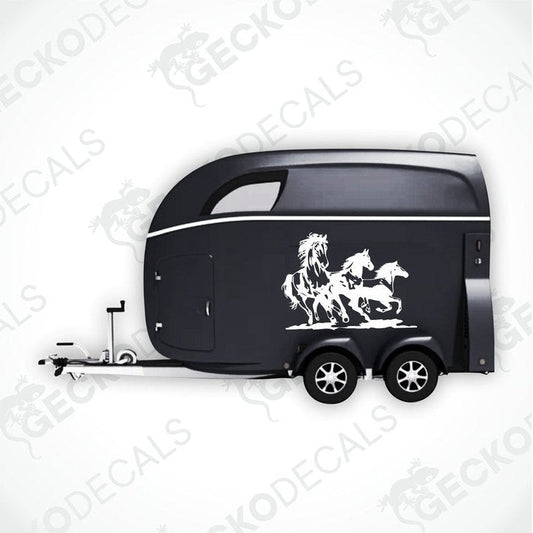 A black trailer with a die cut decal featuring three running horses on the side.