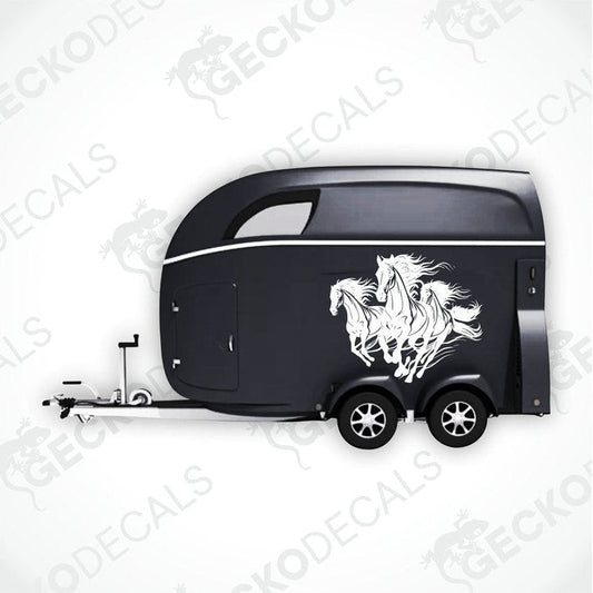 A black trailer with a die cut decal featuring three running horses on the side.