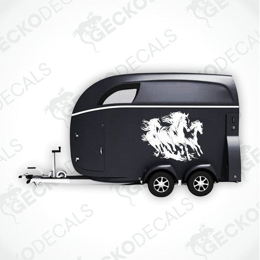 A black trailer with a die cut decal featuring three running horses on the side.