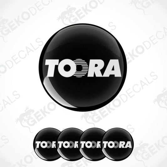 A set of black vinyl decals with the brand name TOORA, displayed in a circular arrangement with one large decal and four smaller ones.