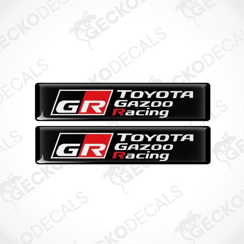 Two Toyota Gazoo Racing logo on black background epoxy decals on a white background with 'Gecko Decals' branding.