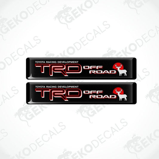 Two black vinyl decals with red and white text that read 'TOYOTA RACING DEVELOPMENT TRD OFF ROAD'.