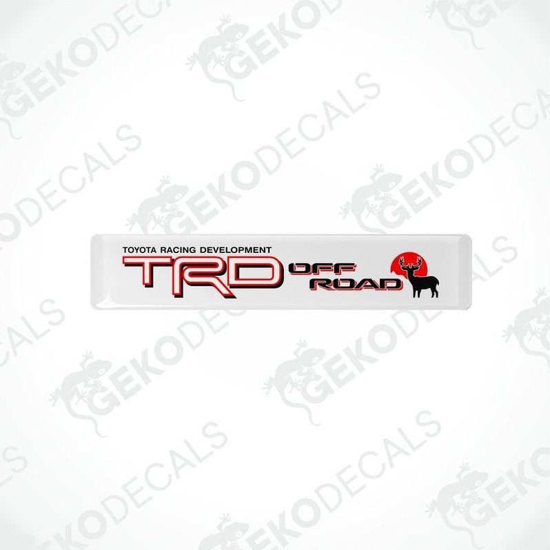 Withe vinyl decals with red and black text that read 'TOYOTA RACING DEVELOPMENT TRD OFF ROAD'.