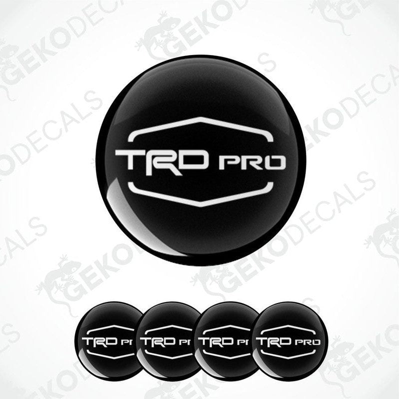 A set of four black vinyl stickers with the 'TOYOTA TRD PRO' logo, designed for use as car decals.