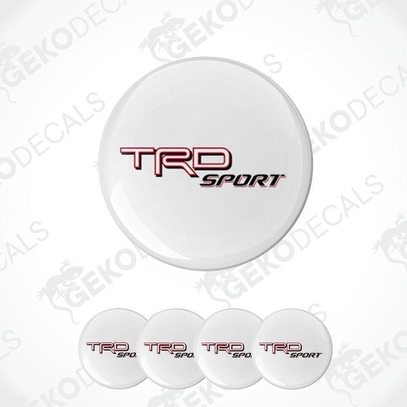 A set of white vinyl stickers with the TOYOTA TRD SPORT logo in red and black, including four stickers with a dome shape designed for vehicle use.