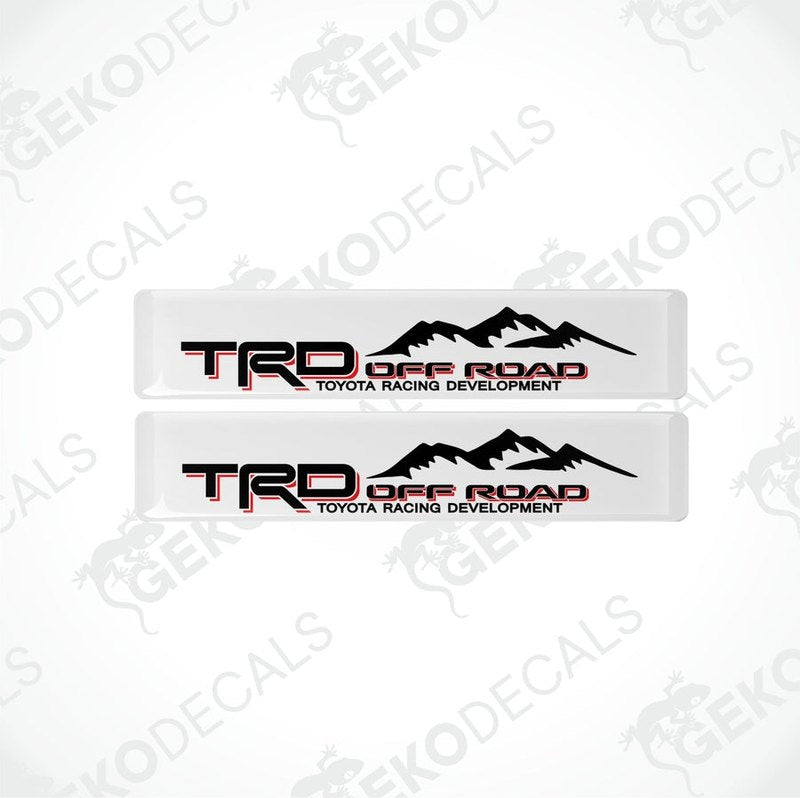 Two withe vinyl stickers with red and black text, featuring the Toyota Racing Development logo.