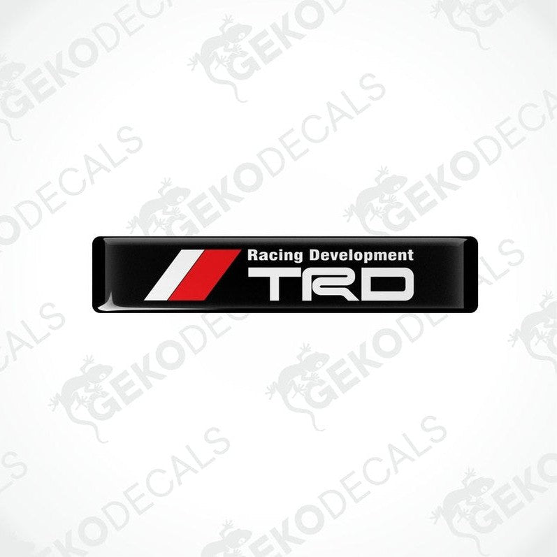 Black, red, and white vinyl decals with the text 'Racing Development TRD' on them.