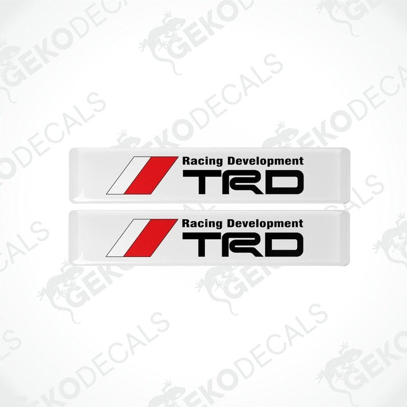 Two withe, red, and black vinyl decals with the text 'Racing Development TRD' on them.