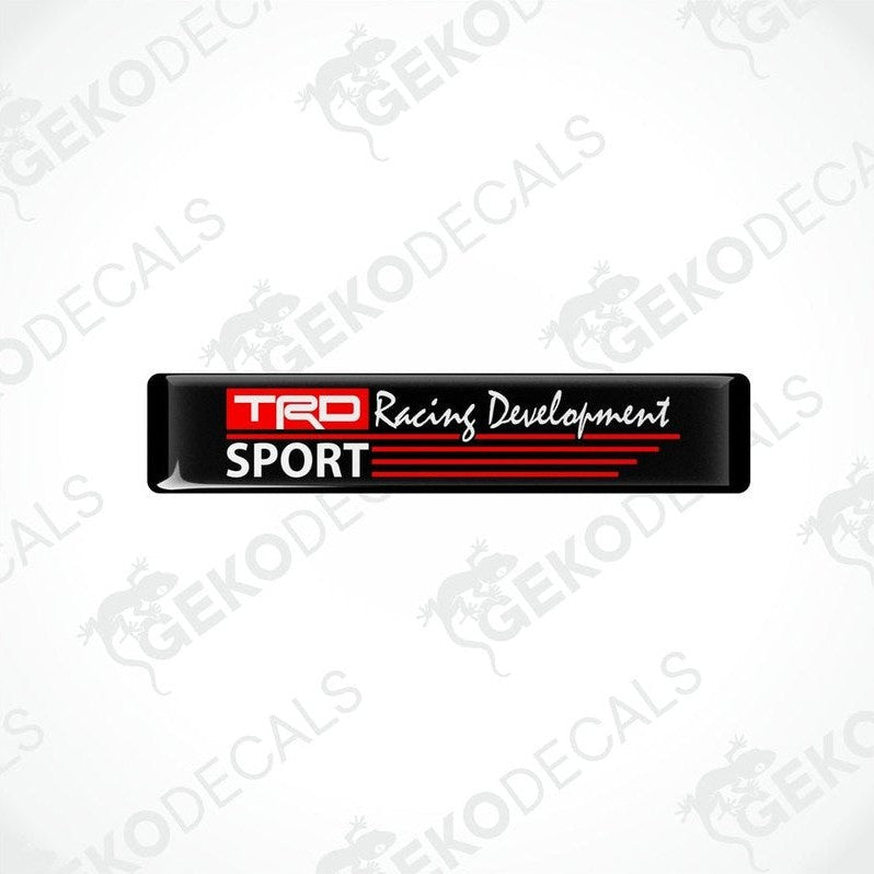 Black vinyl stickers with red and white text that reads 'TRD RACING DEVELOPMENT SPORT'. There are two Gecko Decals logos, one at the top and one at the bottom, with a watermark that says 'GECKODECALS'.
