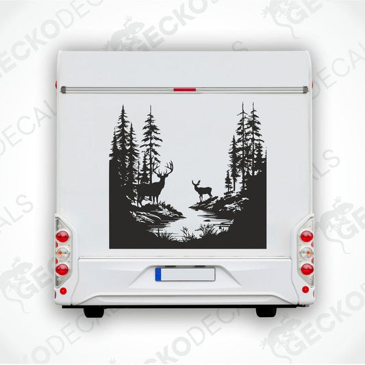 A die cut decal of two deer in a forest setting, intended for use on vehicles or other surfaces.