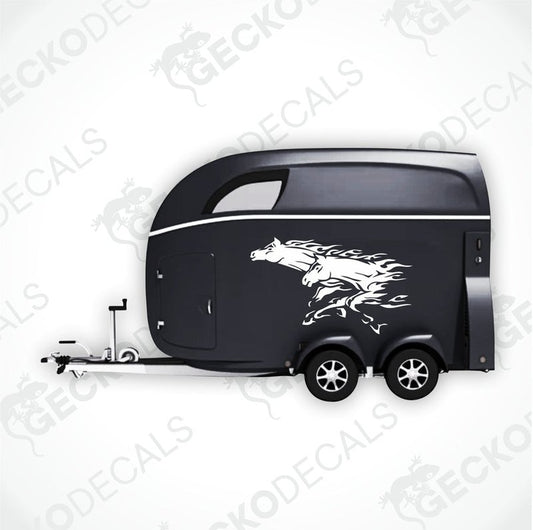 Two black die cut decals of running horses with tribal designs on a white background.