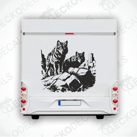 A black and white image of two wolves howling in a forest, applied as a decal on the side of a white vehicle.
