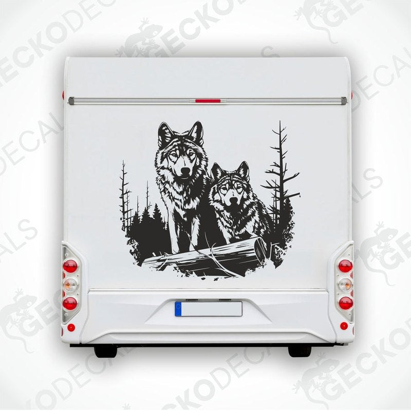 A decal featuring two black and white wolves walking in a forest.
