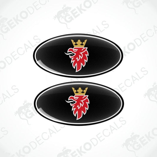 Two black, red, and white car decals with a design that includes a crown and a stylized bird.