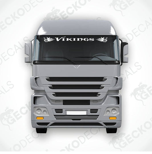 A die cut decal with the text 'Vikings' displayed on the upper part of a truck's windscreen. The decal features a Viking helmet design.