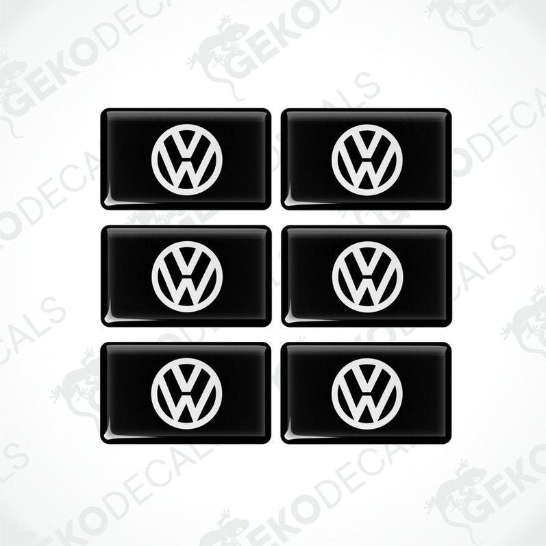 A set of six black vinyl stickers with the Volkswagen logo on them.