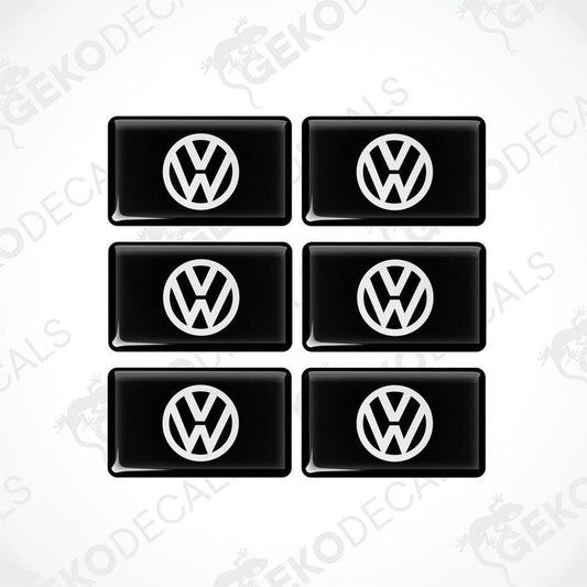 A set of six black vinyl stickers with the Volkswagen logo on them.