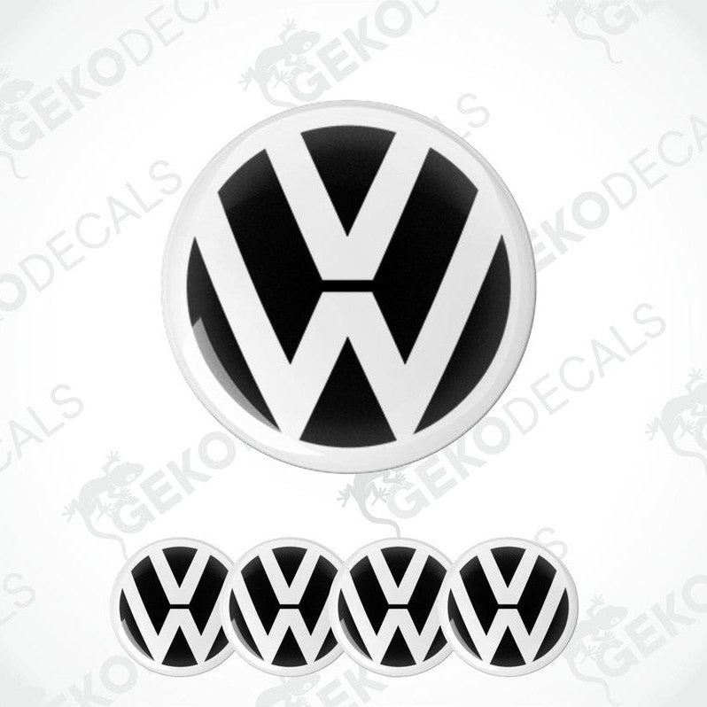 A set of four black and white vinyl stickers with a dome shape and the Volkswagen logo on each.