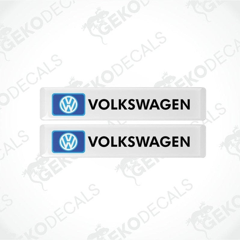 Two withe rectangular vinyl decals with VOLKSWAGEN.' text and the Volkswagen logo in blue.