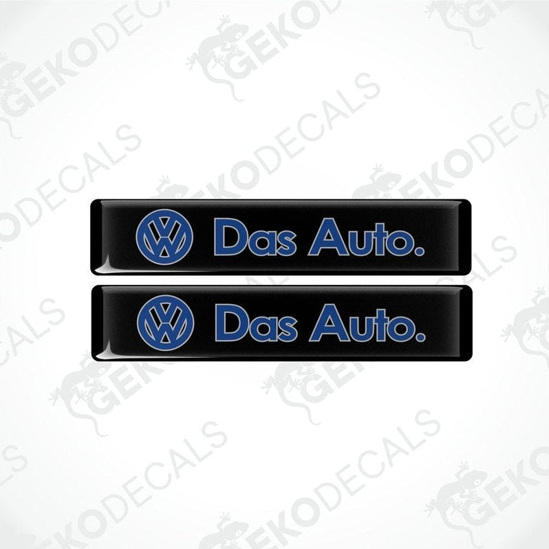 Two black rectangular vinyl decals with 'Das Auto.' text and the Volkswagen logo in blue.