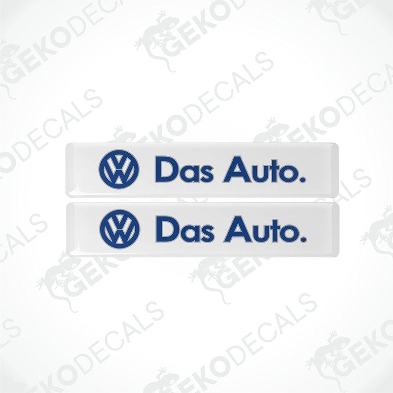 Two withe rectangular vinyl decals with 'Das Auto.' text and the Volkswagen logo in blue.