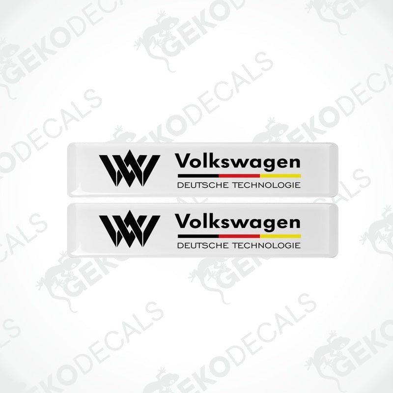 Two withe vinyl stickers with the text 'Volkswagen Deutschtechnologie' and the VW logo in black and red colors.