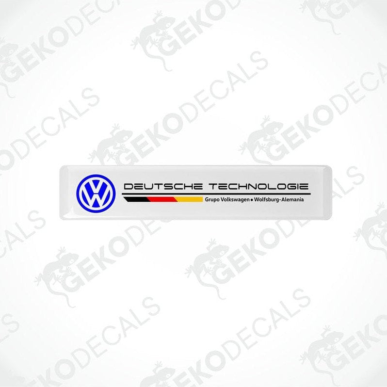 Withe vinyl stickers with the text 'DEUTSCHE TECHNOLOGIE' and the Volkswagen logo, one with a red and yellow stripe and the other with a blue and yellow stripe.