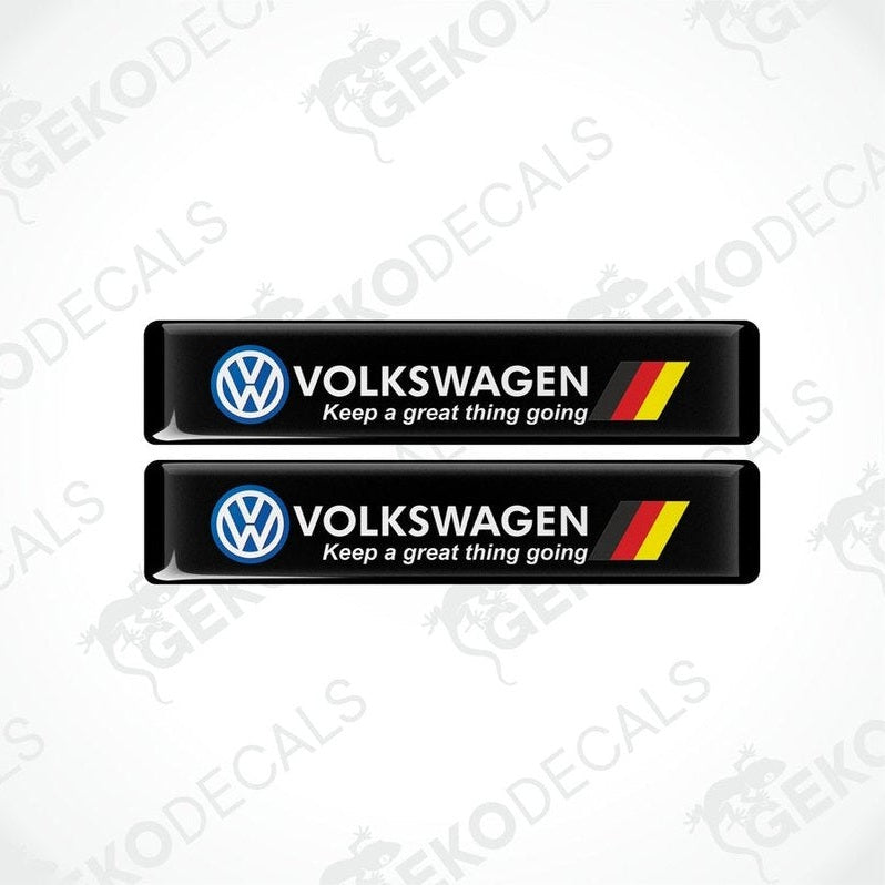 Two black vinyl decals with the Volkswagen logo and the phrase 'Keep a great thing going' printed in white and red.