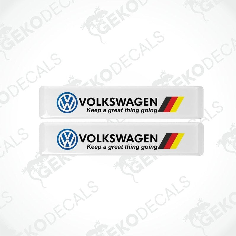 Two withe vinyl decals with the Volkswagen logo and the phrase 'Keep a great thing going' printed in black and red.