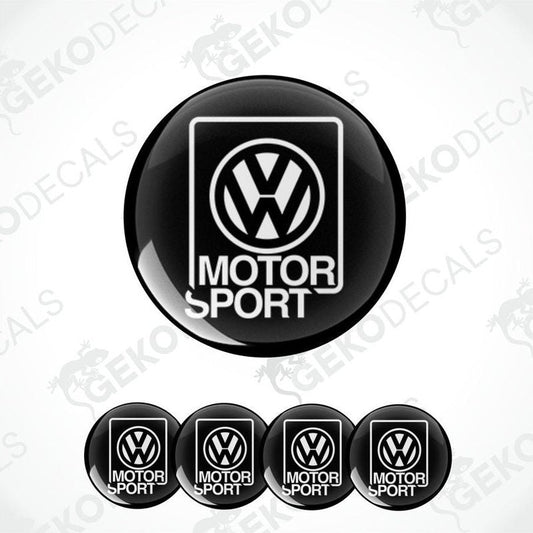 A set of four black vinyl stickers with the word 'MOTORSPORT' and the Volkswagen logo on each sticker.